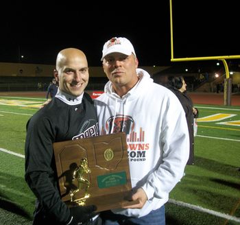 Coach Todd Filtz & I holding another Maple trophy for him! Maple Heights beats Olmsted Falls, 48-16 MUSTANG POWER! 11.19.2010
