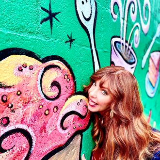 Joy Chapman in front of ice cream mural