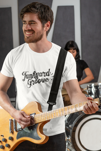 musician wearing a white junkyard groove tshirt