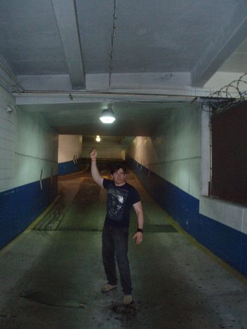 Bryan dancing in a parking lot.
