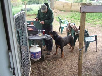 Rogue helping John bbq.
