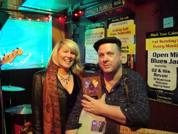 Patty Reese delivers Dave's 2008 Wammie for Best Roots Rock Instrumentalist to Dave's gig!
