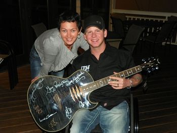 US Soldier, John Michael Vail presents Patti Deromedi a signed Lynyrd Skynyrd guitar, on behalf of the HEART STRINGS for HEROES foundation
