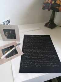 Handwritten lyrics with album