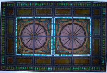 A beautiful ceiling of Tiffany glass presides over the mansion's entryway.
