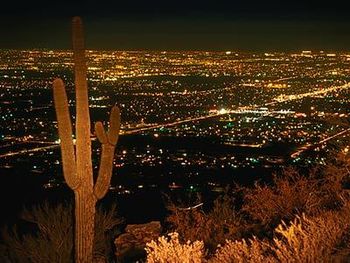 This is a favorite vista, the Tucson night skyline as seen from the top of Campbell Road, circa 1984.
