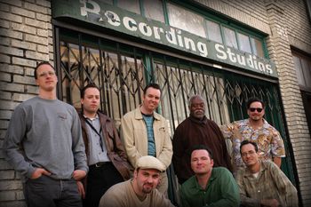 March 2003. Photo by Vernon T. Williams (www.vernont.com). Recording session with the Hollywood Combo at Joey’s Place (formerly the Electro-Vox studio) in Hollywood. From left to right, back row, Dave Berntson-drums, Jim Jedeikin- sax, Myself, Big Jay MacNeeley-sax, Mark Tortorici -vocals/harmonica/leader. Front row Frank Tutwieler-gtr, Brent Harding-bass, Wally Hersom-engineer.
