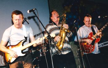 Guitarists Robbie McIntosh & Hamish Stuart and legendary sax man Jim Horn
