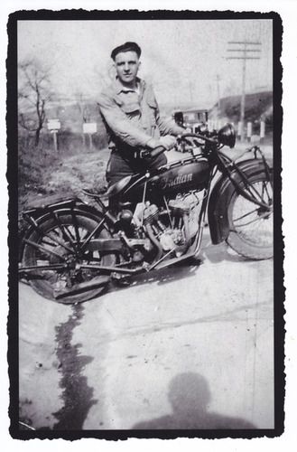 Tony Speal gearing up for a ride on Dan's Indian motorcycle.
