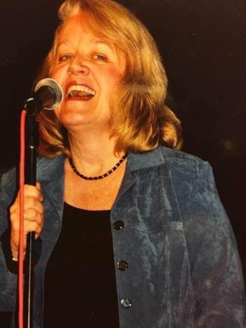 Singing in Ellicott City MD, photo Pris Warnock, back in the 90's
