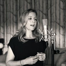 Harriet Fraser singing into microphone