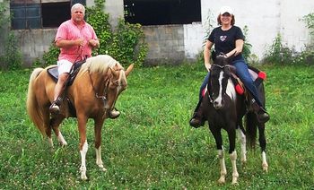 Steve and Tammy getting ready to ride Babe and Cracker in the July 4th parade.
