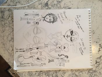 Sketches of the dolls and outfits.
