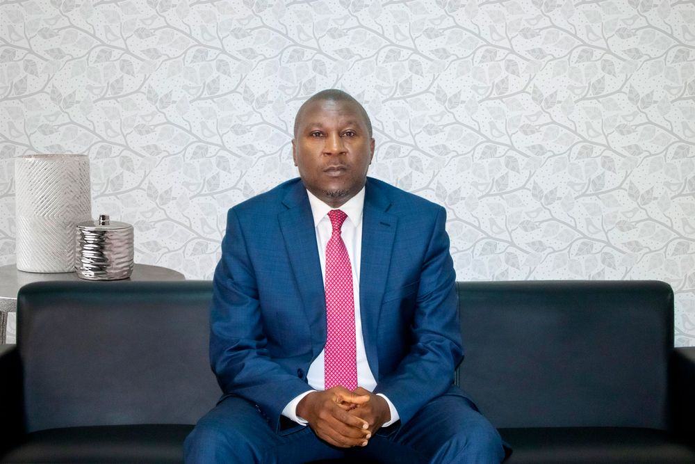 Hon. Justice Musa Ssekaana seated in his office at the Civil Division of the High Court of Uganda