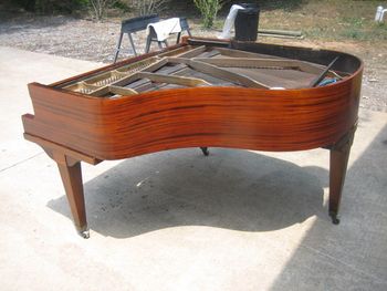 Same grand piano after being stripped,sealed and had it's tinted clear coat applied, no stain, this is natural wood.
