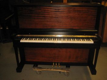 1921 Milton completed with new key covers, polished hardware,matching bench, this is our signature two tone type finish. Mahogany doors are natural, no stain, main cabinet is satin ebony. Sharp !
