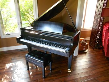 1985 Kawai, new satin ebony finish,New concert grand casters, decal, cleaned, brass polished hard to believe it's the same piano we started with.
