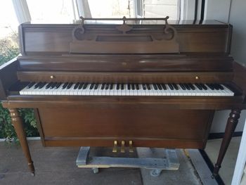1970 Wurlitzer in walnut, matching bench, this is a console. great shape one owner. 900.00 delivered, tuned, warranty.
