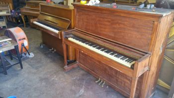 1908 Knabe upright with a really bad DIY stripping job. We decided to just paint it red
