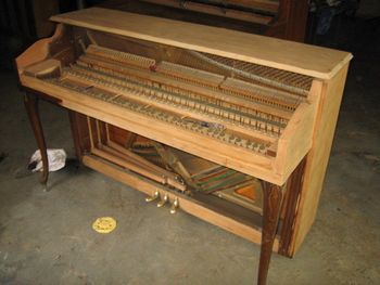 1972 Henry Miller that was in a house fire, other than extreme soot damage it was okay. Entire piano was soda blasted to remove dirt/odors etc
