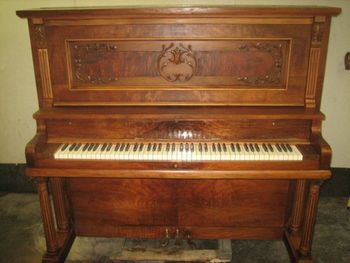 1915 Bush & Lane after refinishing, It got new keytops, cleaned, stripped and then 9 coats of lacquer over the natural wood, no stain. This was tuned to A 440 without any issues. So much for the Myth about antique pianos being not tunable.
