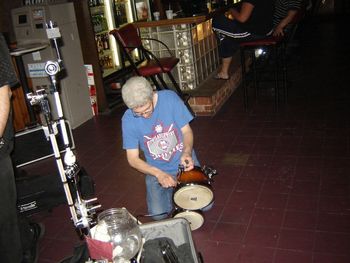 JOEY KAY HERE! FROM BILLY HALEYS COMETS! HE'S TUNING MY BONGOS FOR ME! THE MAN SURE CAN PLAY THEM!

