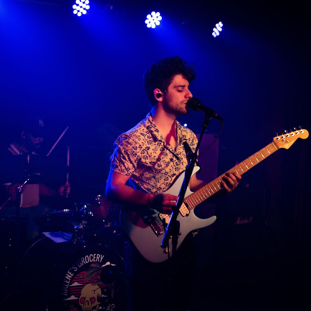 Indie Rock Artist Nick Granelle plays live guitar and sings on stage at Arlenes Grocery in Manhattan New York on Charvel Electric Guitar