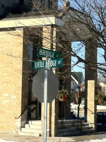 At the corner of Bridge Street and Little Bridge Street. You're gonna cross a bridge either way!

