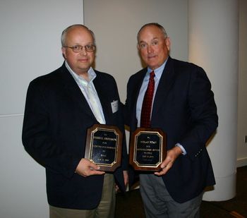 Darrell and pitching legend Nolan Ryan, receiving meritorious service awards from the National Pedigreed Livestock Council
