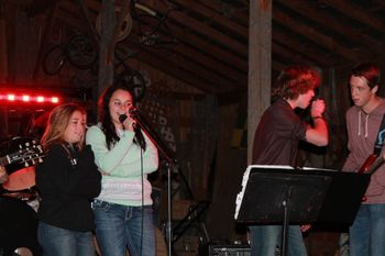 Singing with fans onstage
