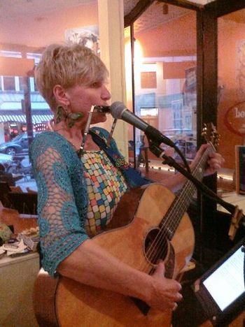 Girl playing Blues Harp Bottega Wine Bar April 2010
