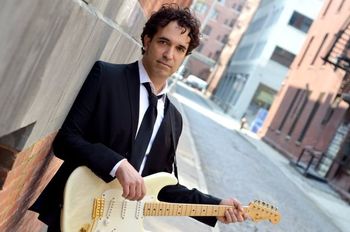Dennis DelGaudio, electric and acoustic guitars
