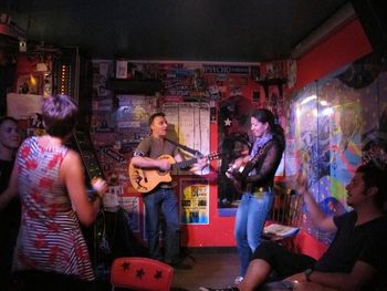 Rocking out at the open mic at Culture Rapide in Paris, France with Paparenda.
