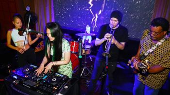 YUKA YU DJ'ed with Soji violin, trumpet, and bass player
