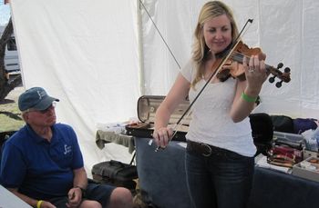 Paula enjoys a well-crafted violin by Frank Daniels at the Bluegrass on the Beach festival in Lake Havasu, Arizona
