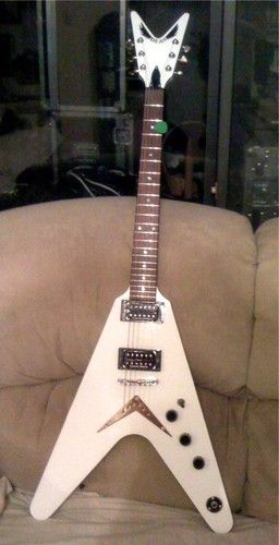 Dean 79 V (This guitar was modified for me when I went to the Dean Guitars factory in Tampa, FL. I had Seymour Duncan pickups installed. A JB in the bridge and a 59 in the neck. The plastic nut was replaced with a graphite one, and better pots were added for a fuller sound with Dimebag Darrell traction knobs)
