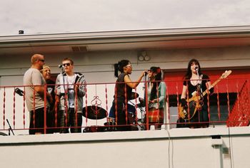 Jamey Clark, Vee Sonnets, Tarl Knight, Corinne Lee, Adrienne Hatkin, & Ellie Maybe lead the crowd in song to wish Tony Menzer a happy birthday! - photo by Eric Storlie
