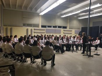 Mrs. Ortelli warms up the Symphonic Band before Musicfest Regionals
