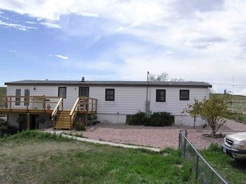 Our house and front yard. We recently covered the deck.
