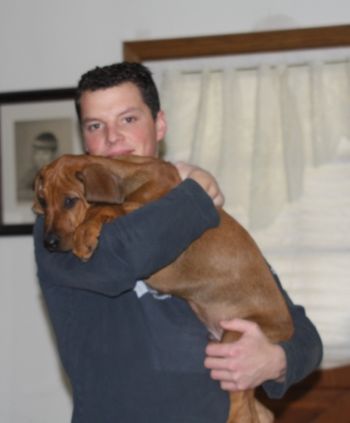 Tony & Eli, his first Ridgeback puppy.
