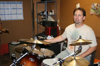 Jason Sumner-LaRussa is really just sitting in with the band until his daughter is old enough to take over the drums full-time. He has detailed knowledge of obscure music acts that are way before his time.
