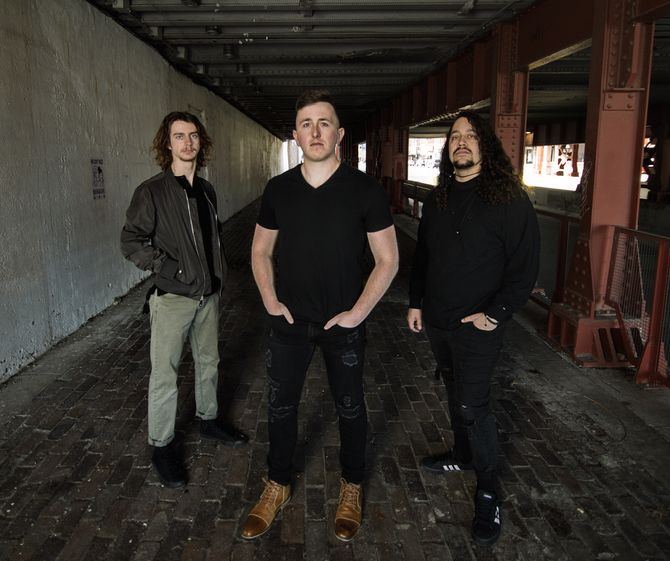 L to R: Tripp Waters (Drums), John Smith (Vocals, Guitar), Christian Vieyra (Bass)