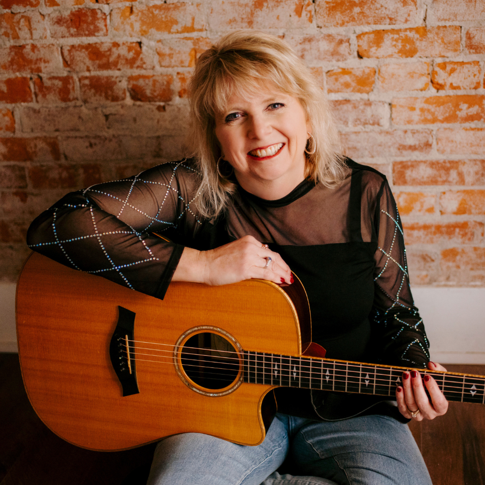 Vickie Maris, singer-songwriter, with Taylor guitar