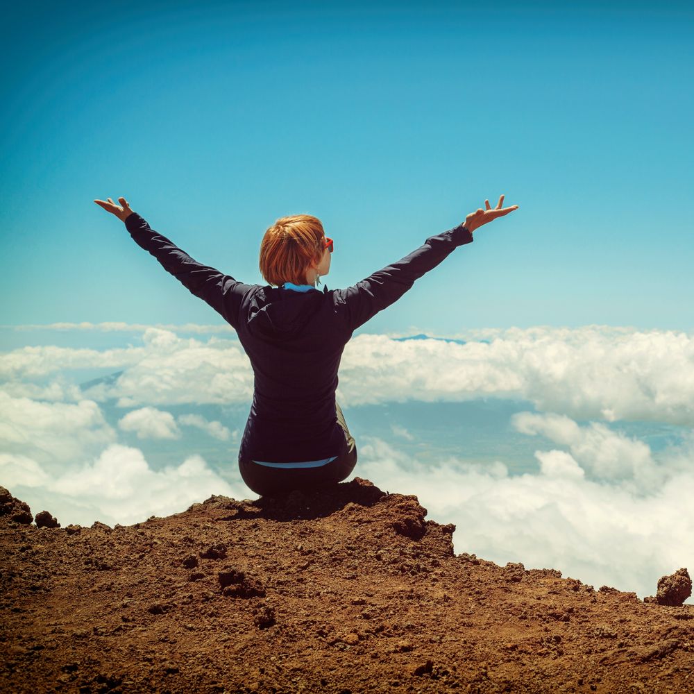 Picture of woman with arms raised