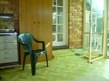 The Glass Room entry into the house(back of photo) and (right) the glass doorway into the Outdoor Runs
