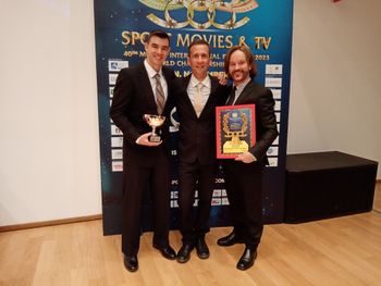 Zakea, Nick Bigtower (Olympic Storytellers section director & founder of the IOWF) and Kehan after winning the FICTS Award for the 'Olympic Storytellers' section
