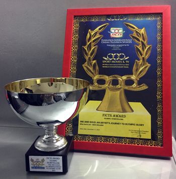 'Olympic Storytellers' winning trophy and FICTS award certificate
