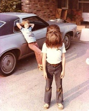 I just had to share this photo. I saw it on social media today. This is a kid (just like me) who became the proud owner of a Chewbacca mask released by Don Post Studios in the summer of 1977. In episode one of "The Star Wars Phenomenon" I tell my own story of begging my parents to drive me to California to pick up a Darth Vader mask directly from the Don Post factory in Glendale. They gave me a tour of the factory and at the end handed me the box and said, "Jon, you are the first customer in the world to receive this mask". Quite a mind blowing experience for a 13 year old Star Wars fanatic! https://youtu.be/1WSw49ccyHM
