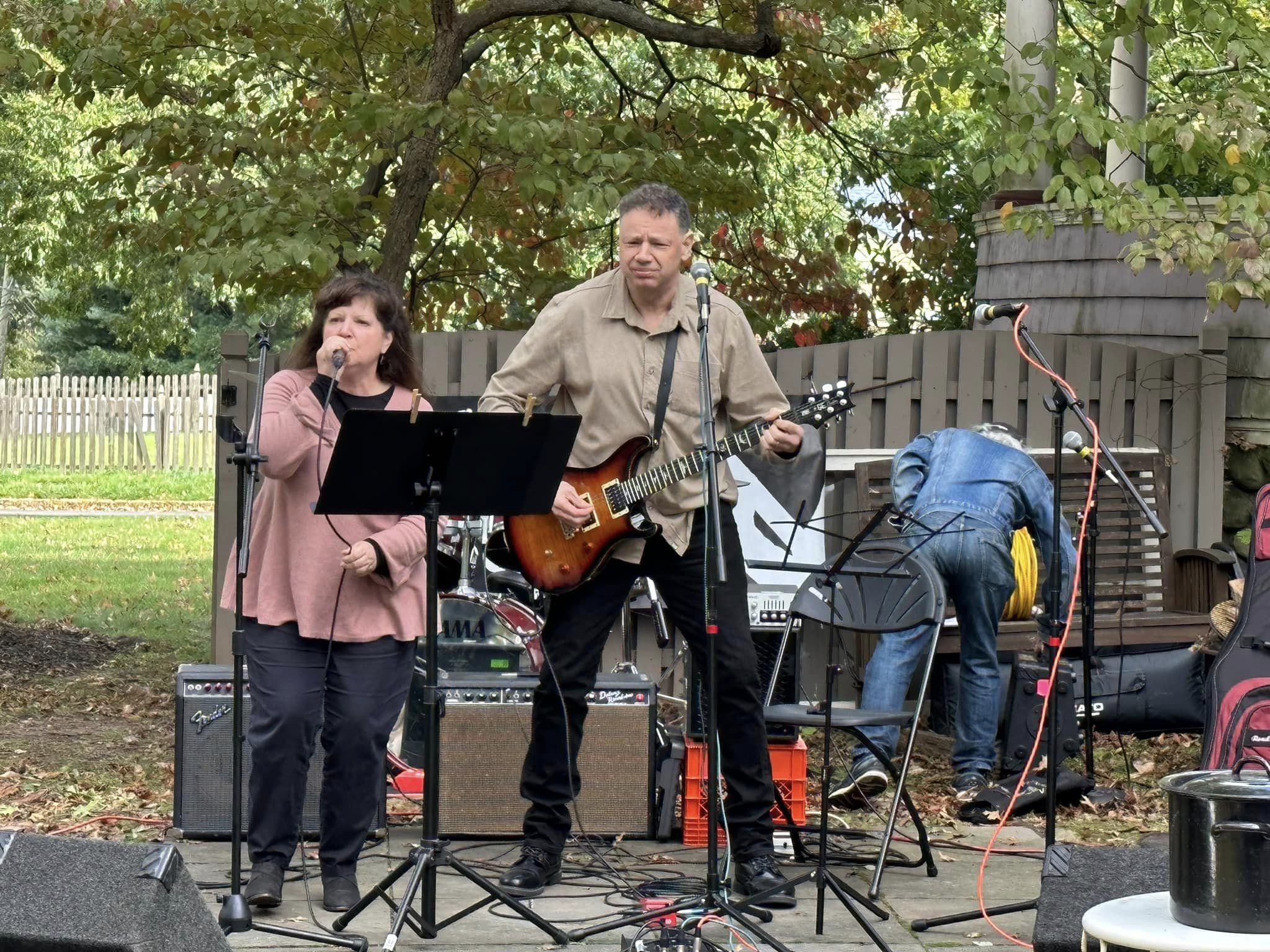 Leslie Masuzzo with Jason Didner accompanying on guitar at Parents Who Rock Backyard Benefit Concert 2023 in Montclair, NJ