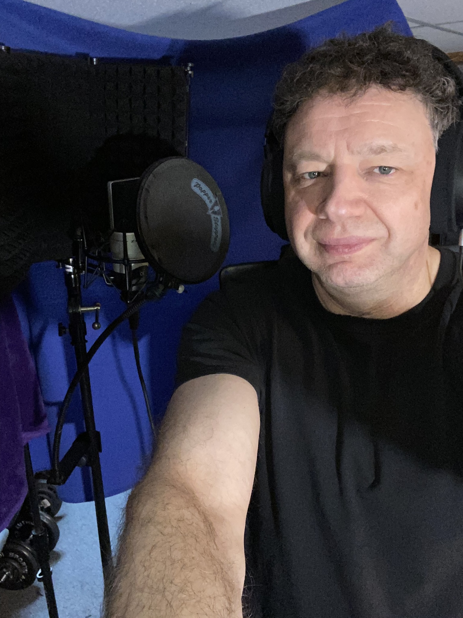 Jason Didner in his home studio recording vocals for his 2024 album 
